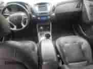 2012 Hyundai Tucson GLS with VIN KM8JUCAC8CU542913, listed as a Copart auction lot 70823765 with 124,426 mi miles and Salvage title. Bid and sale history available at DreamBid. Image 8.