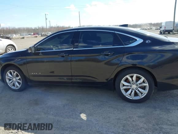 2018 Chevrolet Impala LT with VIN 1G1105S31JU122040, listed as a IAAI auction lot 41863133 with Not provided miles and . Bid and sale history available at DreamBid. Image 13.