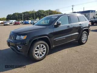 2016 Jeep Grand Cherokee Laredo with VIN 1C4RJFAG2GC379787, listed as a Copart auction lot 84704385 with 112,063 mi miles and Salvage title. Bid and sale history available at DreamBid. Image 1.
