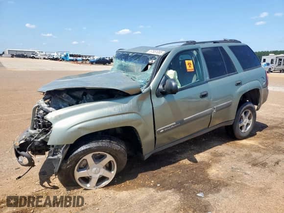 2004 Chevrolet TrailBlazer LT with VIN 1GNDS13S242308271, listed as a Copart auction lot 57851085 with Not provided miles and Salvage title. Bid and sale history available at DreamBid. Image 1.