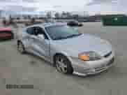 2003 Hyundai Tiburon GT с VIN KMHHN65F63U064962, выставлен на аукционе Copart как лот 44804045 с пробегом 186 171 миль миль и Списание • Salvage title. История ставок и продаж доступна на DreamBid. Изображение 4.