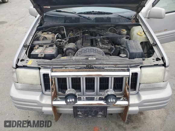 1997 Jeep Grand Cherokee Limited с VIN 1J4GZ78S9VC623295, выставлен на аукционе Copart как лот 58552495 с пробегом 197 818 миль миль и Чистый • Clean title. История ставок и продаж доступна на DreamBid. Изображение 12.