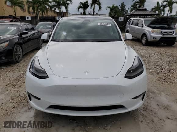 2024 Tesla Model Y z VIN 7SAYGDED6RF098213, wystawiony jako Copart lot #84432265 z przebiegiem 11 983 mil mil oraz Szkoda całkowita • Salvage title. Historia ofert i sprzedaży dostępna na DreamBid. Obrazek 5.