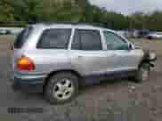 2003 Hyundai Santa Fe GLS z VIN KM8SC73D33U486383, wystawiony jako Copart lot #80148775 z przebiegiem 219 900 mil mil oraz Szkoda całkowita • Salvage title. Historia ofert i sprzedaży dostępna na DreamBid. Obrazek 3.