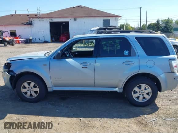 2008 Mercury Mariner with VIN 4M2CU91198KJ24730, listed as a IAAI auction lot 43341107 with 158,521 mi miles and . Bid and sale history available at DreamBid. Image 14.