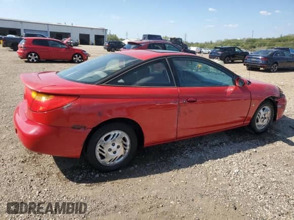2001 Saturn SC с VIN 1G8ZY12701Z296872, выставлен на аукционе Copart как лот 84442165 с пробегом 95 074 миль миль и Списание • Salvage title. История ставок и продаж доступна на DreamBid. Изображение 3.