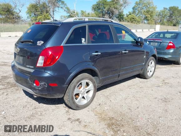 2014 Chevrolet Captiva Sport LT z VIN 3GNAL3EK1ES627272, wystawiony jako IAAI lot #43401535 z przebiegiem 144 872 mil mil oraz . Historia ofert i sprzedaży dostępna na DreamBid. Obrazek 4.