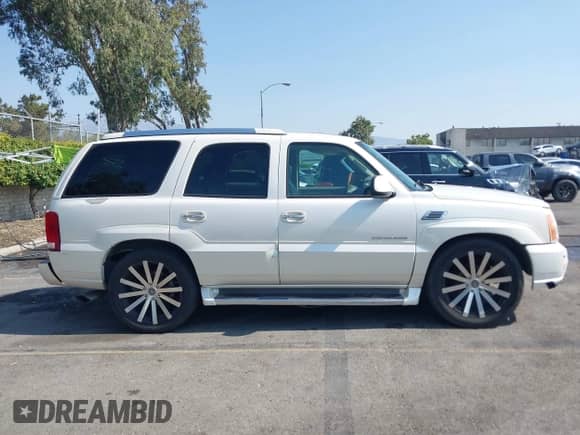 2004 Cadillac Escalade with VIN 1GYEC63T74R310907, listed as a IAAI auction lot 42747095 with 165,755 mi miles and . Bid and sale history available at DreamBid. Image 13.