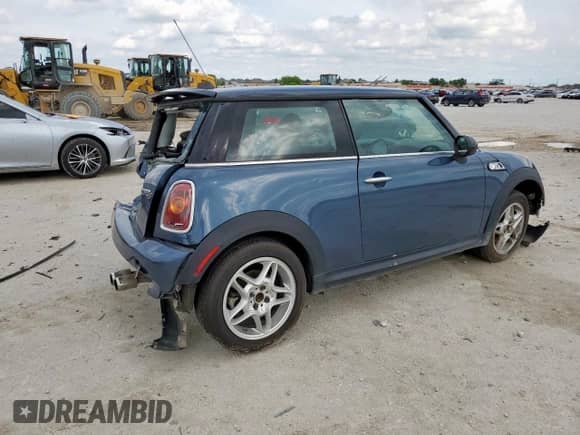 2010 MINI Hardtop S with VIN WMWMF7C51ATZ69061, listed as a Copart auction lot 60837465 with 102,506 mi miles and Salvage title. Bid and sale history available at DreamBid. Image 3.