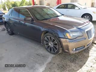2013 Chrysler 300 S with VIN 2C3CCABG3DH561643, listed as a IAAI auction lot 42641476 with 220,674 mi miles and . Bid and sale history available at DreamBid. Image 1.