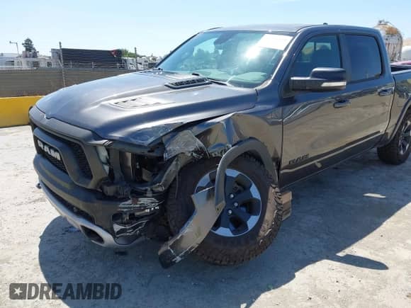 2020 Ram 1500 Rebel z VIN 1C6SRFLT8LN164196, wystawiony jako IAAI lot #42538059 z przebiegiem 60 520 mil mil oraz . Historia ofert i sprzedaży dostępna na DreamBid. Obrazek 6.