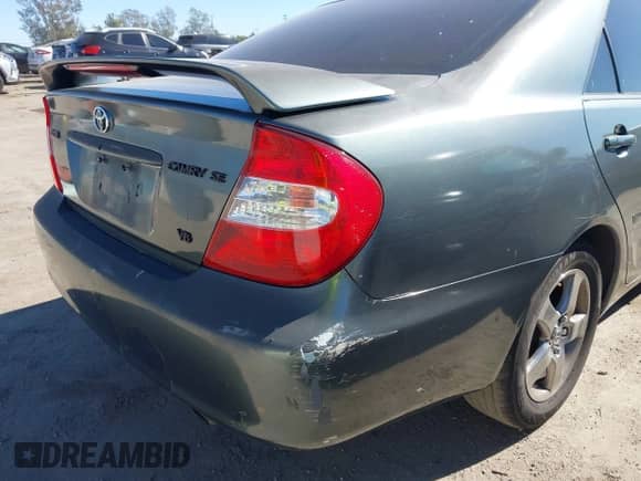 2002 Toyota Camry LE z VIN 4T1BF30K62U502612, wystawiony jako IAAI lot #43578014 z przebiegiem 276 054 mil mil oraz . Historia ofert i sprzedaży dostępna na DreamBid. Obrazek 6.