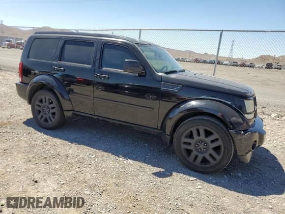 2007 Dodge Nitro R/T with VIN 1D8GT58627W714118, listed as a Copart auction lot 61822234 with 153,959 mi miles and Salvage title. Bid and sale history available at DreamBid. Image 4.