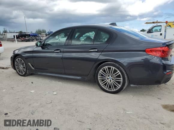 2018 BMW 5 Series M550i xDrive with VIN WBAJB9C53JB286164, listed as a Copart auction lot 71052315 with 91,157 mi miles and Clean title. Bid and sale history available at DreamBid. Image 2.