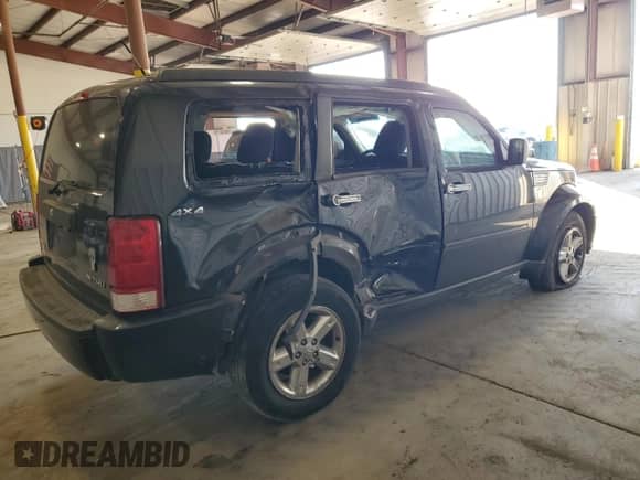 2009 Dodge Nitro SXT z VIN 1D8GU28KX9W536809, wystawiony jako Copart lot #77500034 z przebiegiem 155 737 mil mil oraz Szkoda całkowita • Salvage title. Historia ofert i sprzedaży dostępna na DreamBid. Obrazek 3.