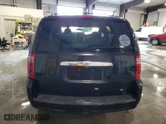 2010 Dodge Grand Caravan SXT z VIN 2D4RN5D17AR409597, wystawiony jako Copart lot #83994974 z przebiegiem Nie podano mil oraz Szkoda całkowita • Salvage title. Historia ofert i sprzedaży dostępna na DreamBid. Obrazek 6.