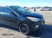 2017 Ford Escape Titanium with VIN 1FMCU0JD6HUE90933, listed as a IAAI auction lot 43035309 with 76,661 mi miles and . Bid and sale history available at DreamBid. Image 6.