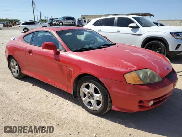 2003 Hyundai Tiburon GT с VIN KMHHN65F53U041351, выставлен на аукционе Copart как лот 52332395 с пробегом 194 821 миль миль и Чистый • Clean title. История ставок и продаж доступна на DreamBid. Изображение 4.