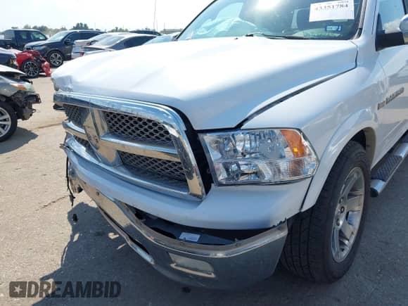 2012 Ram 1500 Laramie z VIN 1C6RD6NT9CS282026, wystawiony jako IAAI lot #43351784 z przebiegiem 183 016 mil mil oraz . Historia ofert i sprzedaży dostępna na DreamBid. Obrazek 6.