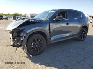 2024 Mazda CX-5 S Carbon Edition z VIN JM3KFBCL2R0518222, wystawiony jako Copart lot #85533705 z przebiegiem Nie podano mil oraz Szkoda całkowita • Salvage title. Historia ofert i sprzedaży dostępna na DreamBid. Obrazek 1.