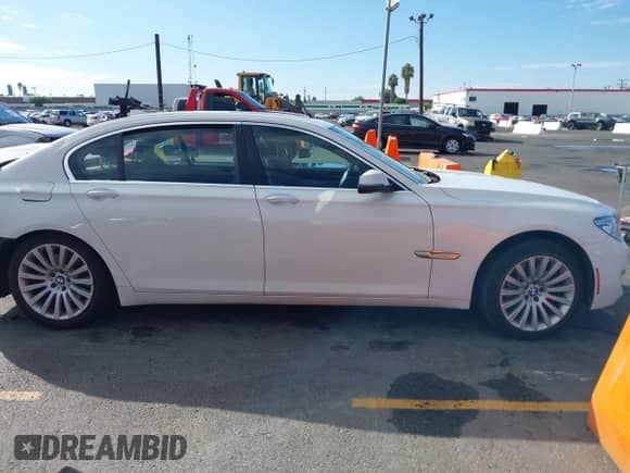 2013 BMW 7 Series 740Li with VIN WBAYE4C51DDW22962, listed as a IAAI auction lot 43249663 with 81,673 mi miles and . Bid and sale history available at DreamBid. Image 12.