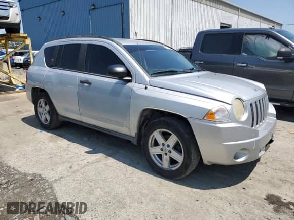 2007 Jeep Compass Sport with VIN 1J8FT47W87D158424, listed as a Copart auction lot 61333865 with 243,861 mi miles and Salvage title. Bid and sale history available at DreamBid. Image 4.