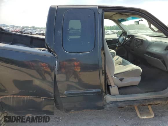 1999 Ford F-150 z VIN 1FTRX18W1XNA90998, wystawiony jako Copart lot #59217415 z przebiegiem Nie podano mil oraz Szkoda całkowita • Salvage title. Historia ofert i sprzedaży dostępna na DreamBid. Obrazek 10.