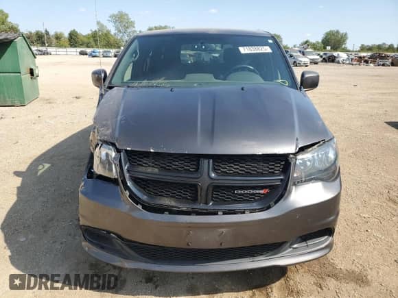 2016 Dodge Grand Caravan American Value with VIN 2C4RDGBG0GR252054, listed as a Copart auction lot 71838825 with 128,684 mi miles and Salvage title. Bid and sale history available at DreamBid. Image 5.