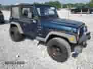 2000 Jeep Wrangler Sport with VIN 1J4FA49S5YP744967, listed as a Copart auction lot 67909665 with 141,990 mi miles and Clean title. Bid and sale history available at DreamBid. Image 4.