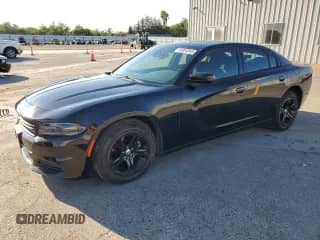 2015 Dodge Charger SE with VIN 2C3CDXBG6FH812058, listed as a Copart auction lot 81084845 with 114,101 mi miles and Salvage title. Bid and sale history available at DreamBid. Image 1.