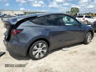 2023 Tesla Model Y Long Range with VIN 7SAYGAEE6PF661104, listed as a Copart auction lot 69421904 with 34,605 mi miles and Salvage title. Bid and sale history available at DreamBid. Image 3.