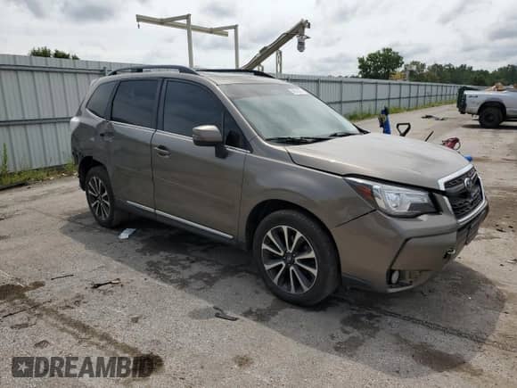 2017 Subaru Forester Touring z VIN JF2SJGWC1HH557983, wystawiony jako Copart lot #68510025 z przebiegiem 122 654 mil mil oraz Szkoda całkowita • Salvage title. Historia ofert i sprzedaży dostępna na DreamBid. Obrazek 4.