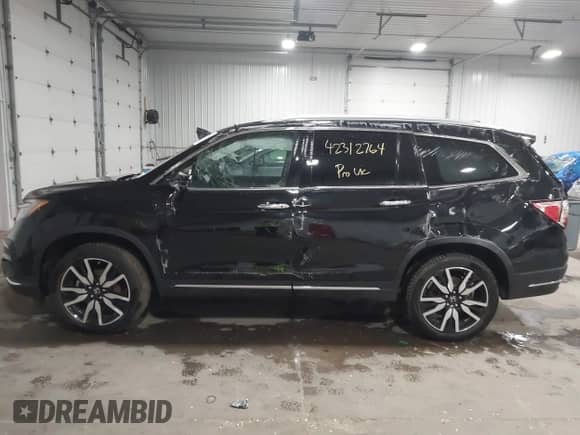 2021 Honda Pilot Touring 7-Passenger с VIN 5FNYF6H63MB082603, выставлен на аукционе IAAI как лот 42312764 с пробегом 60 000 миль миль и . История ставок и продаж доступна на DreamBid. Изображение 14.