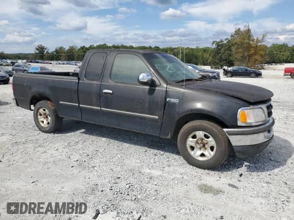 1998 Ford F-150 z VIN 1FTDX172XWNA12453, wystawiony jako Copart lot #85690415 z przebiegiem 233 784 mil mil oraz Czysty tytuł • Clean title. Historia ofert i sprzedaży dostępna na DreamBid. Obrazek 4.