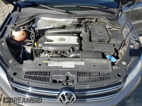 2014 Volkswagen Tiguan SEL with VIN WVGAV3AX8EW585929, listed as a Copart auction lot 61462205 with 63,899 mi miles and Salvage title. Bid and sale history available at DreamBid. Image 12.