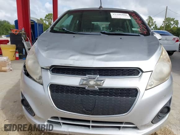 2014 Chevrolet Spark LT z VIN KL8CD6S94EC535413, wystawiony jako IAAI lot #43396800 z przebiegiem 165 415 mil mil oraz . Historia ofert i sprzedaży dostępna na DreamBid. Obrazek 6.