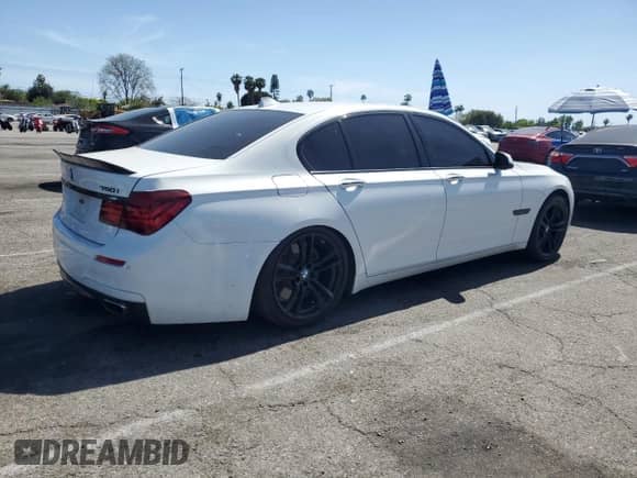 2013 BMW 7 Series 750i with VIN WBAYA8C54DC996412, listed as a Copart auction lot 56982895 with 124,258 mi miles and Salvage title. Bid and sale history available at DreamBid. Image 3.