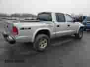 2003 Dodge Dakota Sport z VIN 1D7HG38X43S212335, wystawiony jako Copart lot #85670114 z przebiegiem 161 851 mil mil oraz Szkoda całkowita • Salvage title. Historia ofert i sprzedaży dostępna na DreamBid. Obrazek 3.