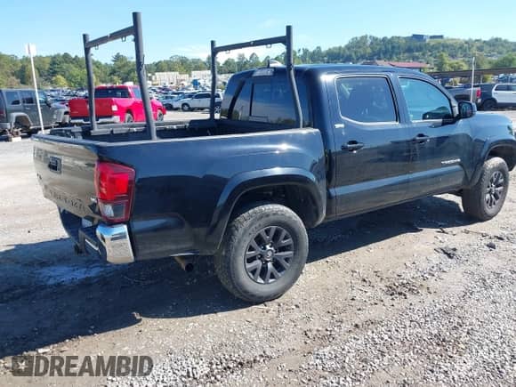 2021 Toyota Tacoma SR with VIN 5TFCZ5AN4MX273658, listed as a IAAI auction lot 43334186 with 70,498 mi miles and . Bid and sale history available at DreamBid. Image 4.