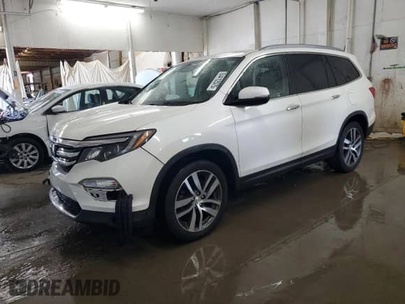 2017 Honda Pilot Touring z VIN 5FNYF5H91HB029263, wystawiony jako Copart lot #64412575 z przebiegiem 111 645 mil mil oraz Szkoda całkowita • Salvage title. Historia ofert i sprzedaży dostępna na DreamBid. Obrazek 1.