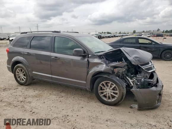 2017 Dodge Journey SXT with VIN 3C4PDCBB8HT677007, listed as a Copart auction lot 66101285 with 117,202 mi miles and Salvage title. Bid and sale history available at DreamBid. Image 4.