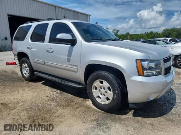2014 Chevrolet Tahoe LT with VIN 1GNSCBE07ER135040, listed as a Copart auction lot 65328115 with 114,497 mi miles and Salvage title. Bid and sale history available at DreamBid. Image 4.