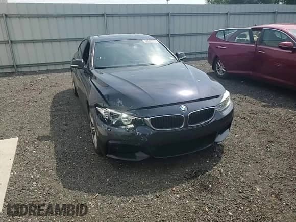 2015 BMW 4 Series 428i xDrive z VIN WBA4C9C58FD330455, wystawiony jako Copart lot #60933335 z przebiegiem 146 776 mil mil oraz Szkoda całkowita • Salvage title. Historia ofert i sprzedaży dostępna na DreamBid. Obrazek 13.