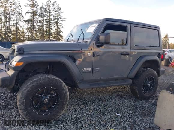 2019 Jeep Wrangler Sport S with VIN 1C4GJXAG3KW518815, listed as a IAAI auction lot 40689483 with 97,268 mi miles and . Bid and sale history available at DreamBid. Image 14.