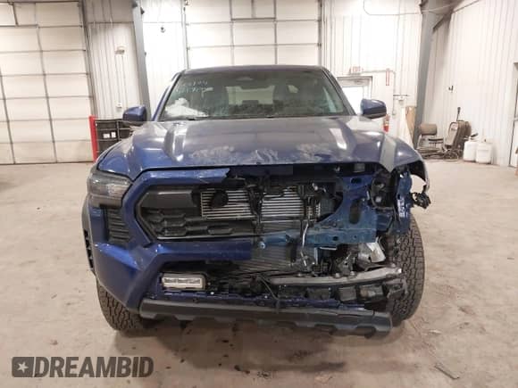 2024 Toyota Tacoma SR5 with VIN 3TMLB5JN3RM054207, listed as a IAAI auction lot 41171946 with 3,808 mi miles and . Bid and sale history available at DreamBid. Image 12.