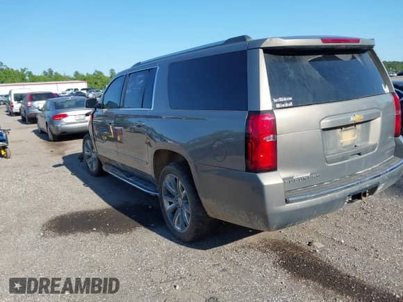 2019 Chevrolet Suburban Premier with VIN 1GNSCJKC3KR129739, listed as a IAAI auction lot 42044708 with 105,771 mi miles and . Bid and sale history available at DreamBid. Image 3.