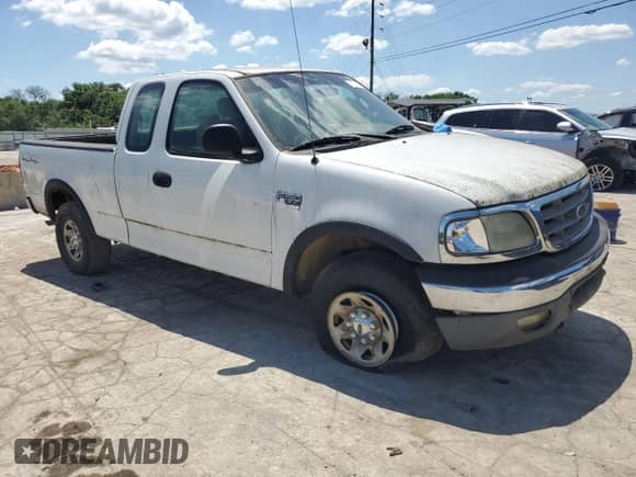 2002 Ford F-150 XL with VIN 2FTPX18L92CA44010, listed as a Copart auction lot 74502864 with Not provided miles and Salvage title. Bid and sale history available at DreamBid. Image 4.
