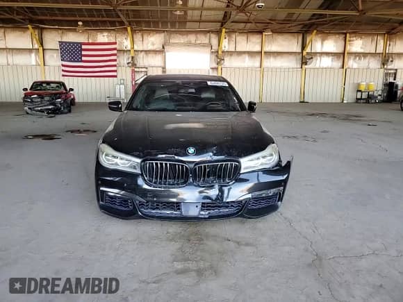 2016 BMW 7 Series 750i с VIN WBA7F0C56GGL99824, выставлен на аукционе Copart как лот 62845125 с пробегом 114 694 миль миль и Списание • Salvage title. История ставок и продаж доступна на DreamBid. Изображение 13.