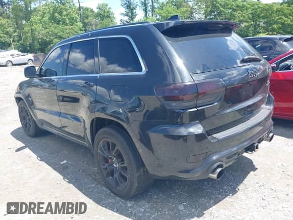 2014 Jeep Grand Cherokee SRT-8 z VIN 1C4RJFDJ2EC131267, wystawiony jako IAAI lot #42301339 z przebiegiem 174 980 mil mil oraz . Historia ofert i sprzedaży dostępna na DreamBid. Obrazek 3.