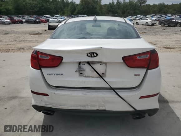 2015 Kia Optima LX with VIN KNAGM4A79F5630761, listed as a Copart auction lot 70302334 with 106,427 mi miles and Salvage title. Bid and sale history available at DreamBid. Image 6.